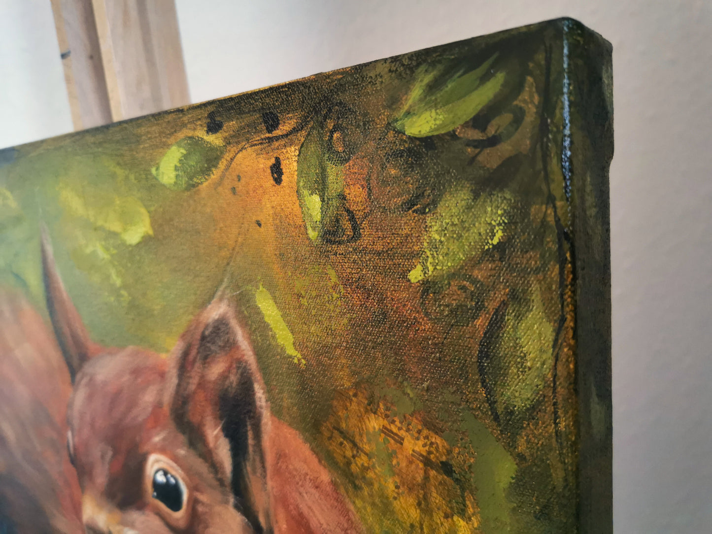 corner or a painting showing leaves and branches and abstract elements