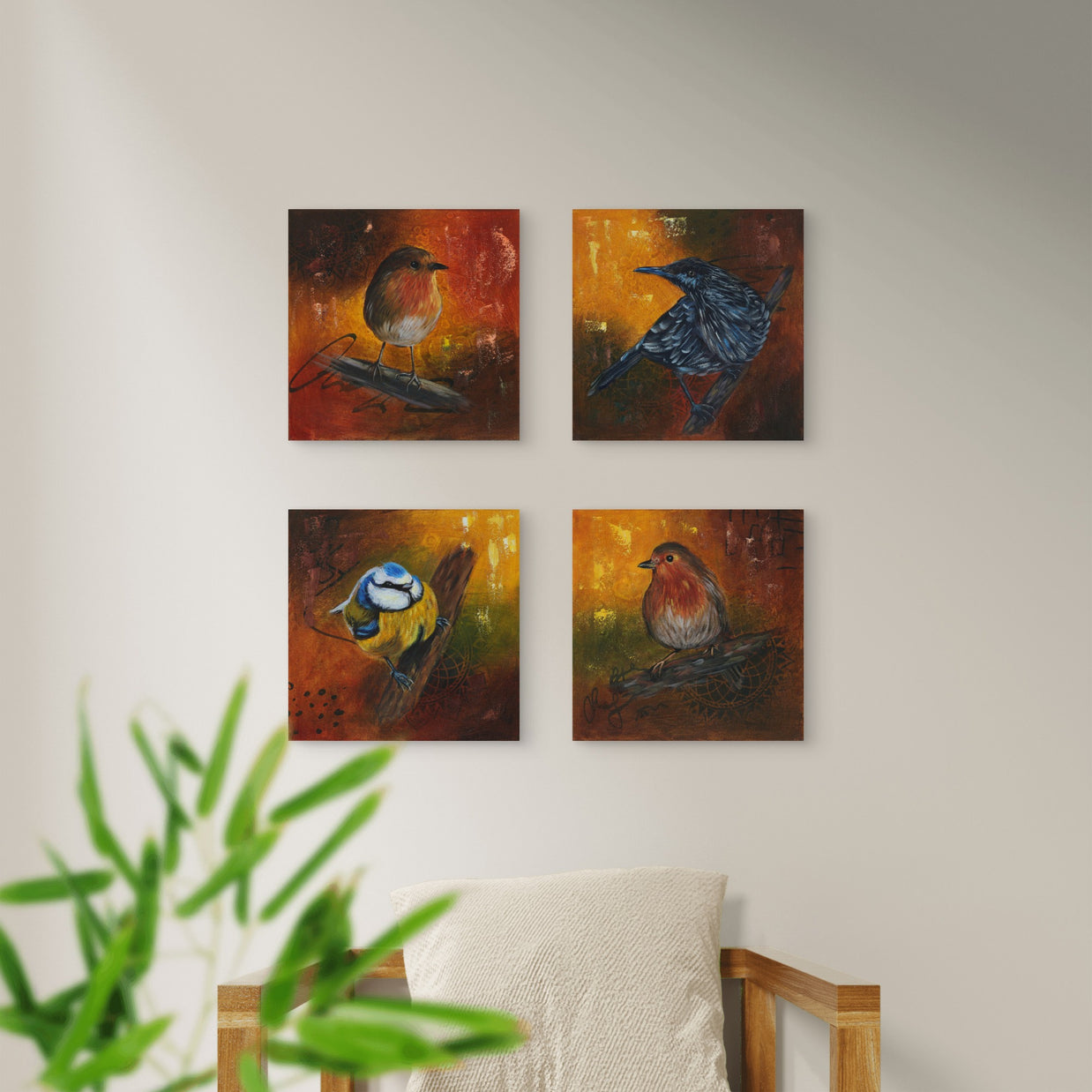 Arrangement of small bird paintings on a wall.