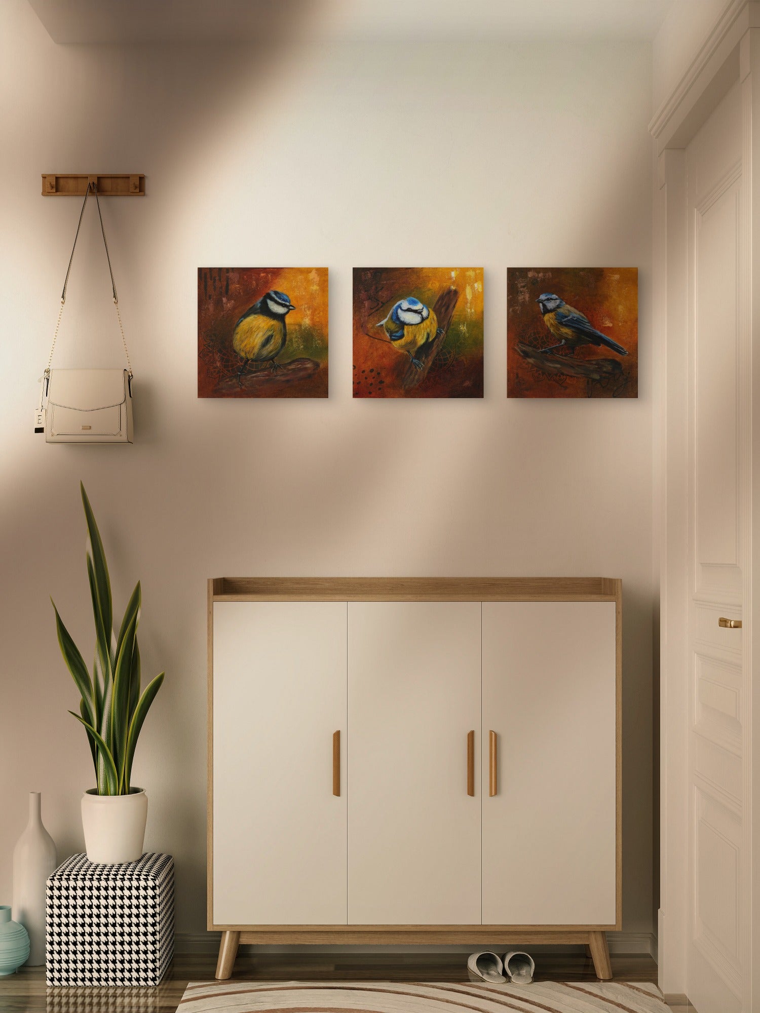 A bright hallway featuring an arrangement of 3 blue tit paintings.