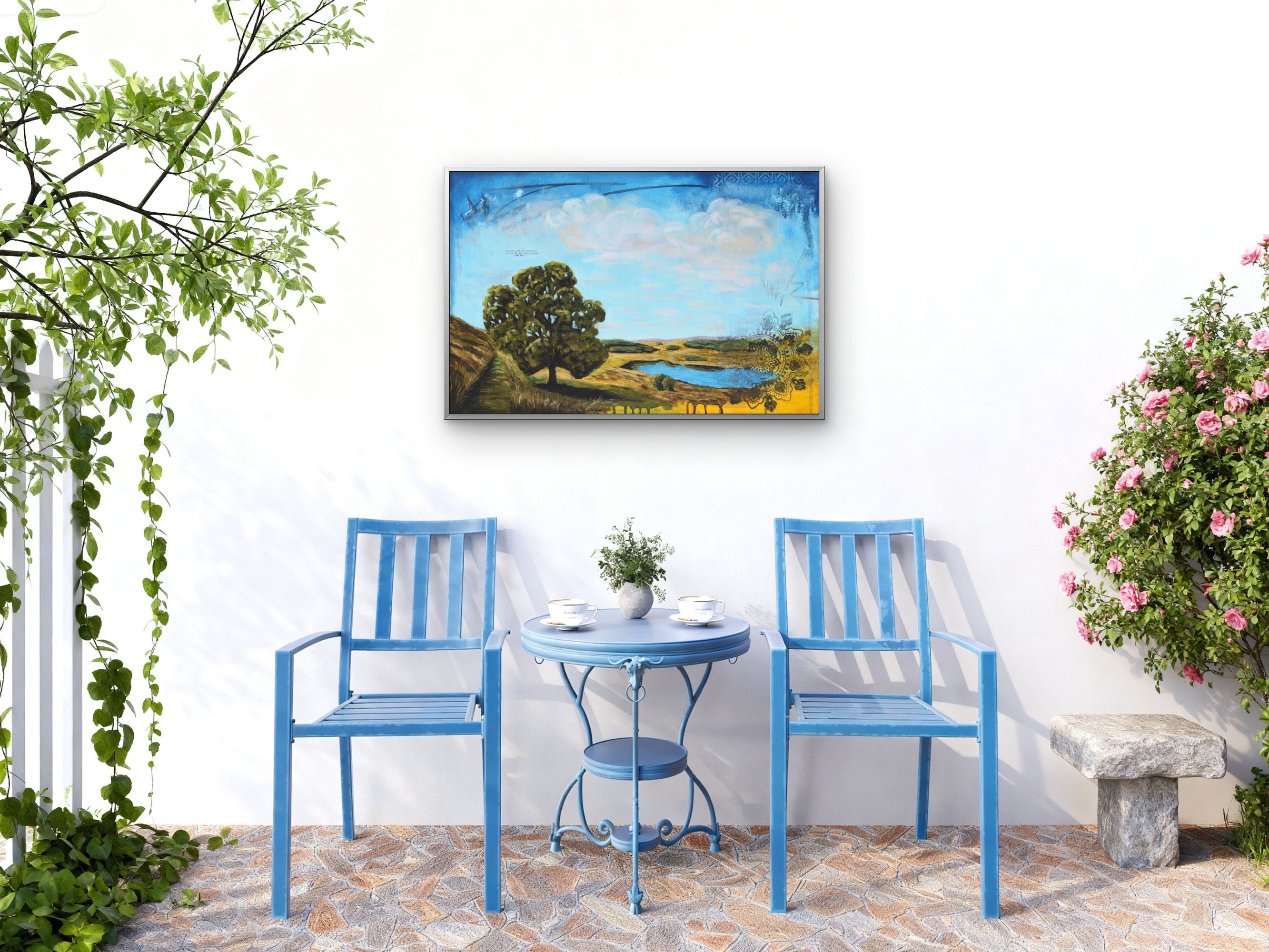 Balcony with blue chairs and table and a landscape painting.