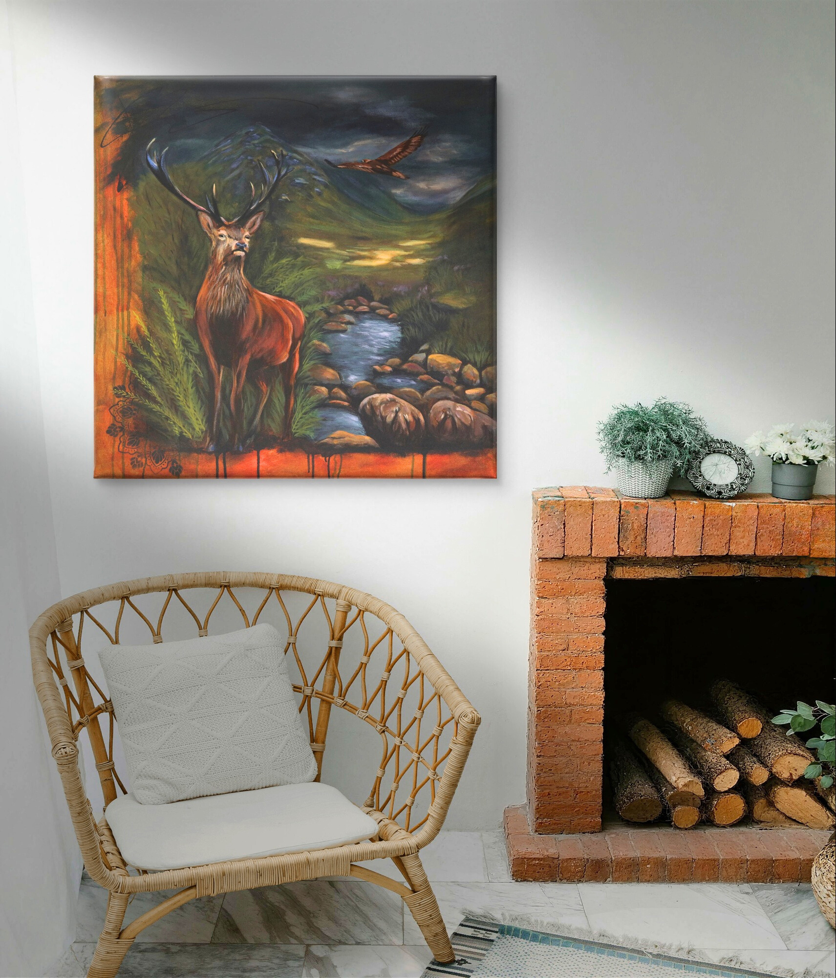 Cosy fireplace sitting space stag painting decorating the wall.