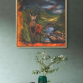 Grey wall featuring framed painting of the stag and the bird of prey.