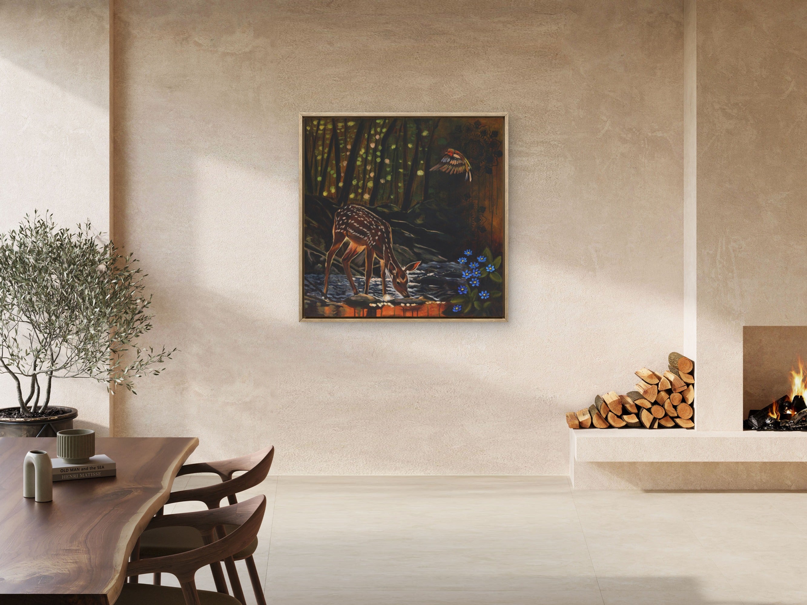 Modern open plan living space featuring foe deer painting near fire place.