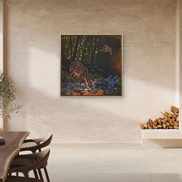 Modern open plan living space featuring foe deer painting near fire place.