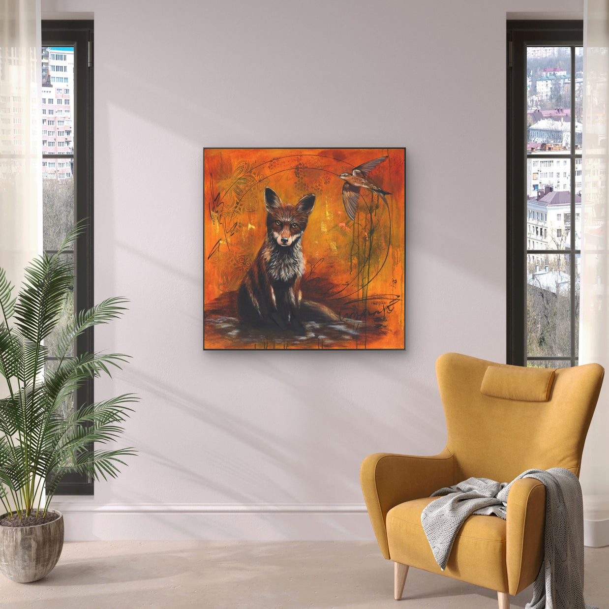 Bright sitting area with yellow armchair and fox painting.
