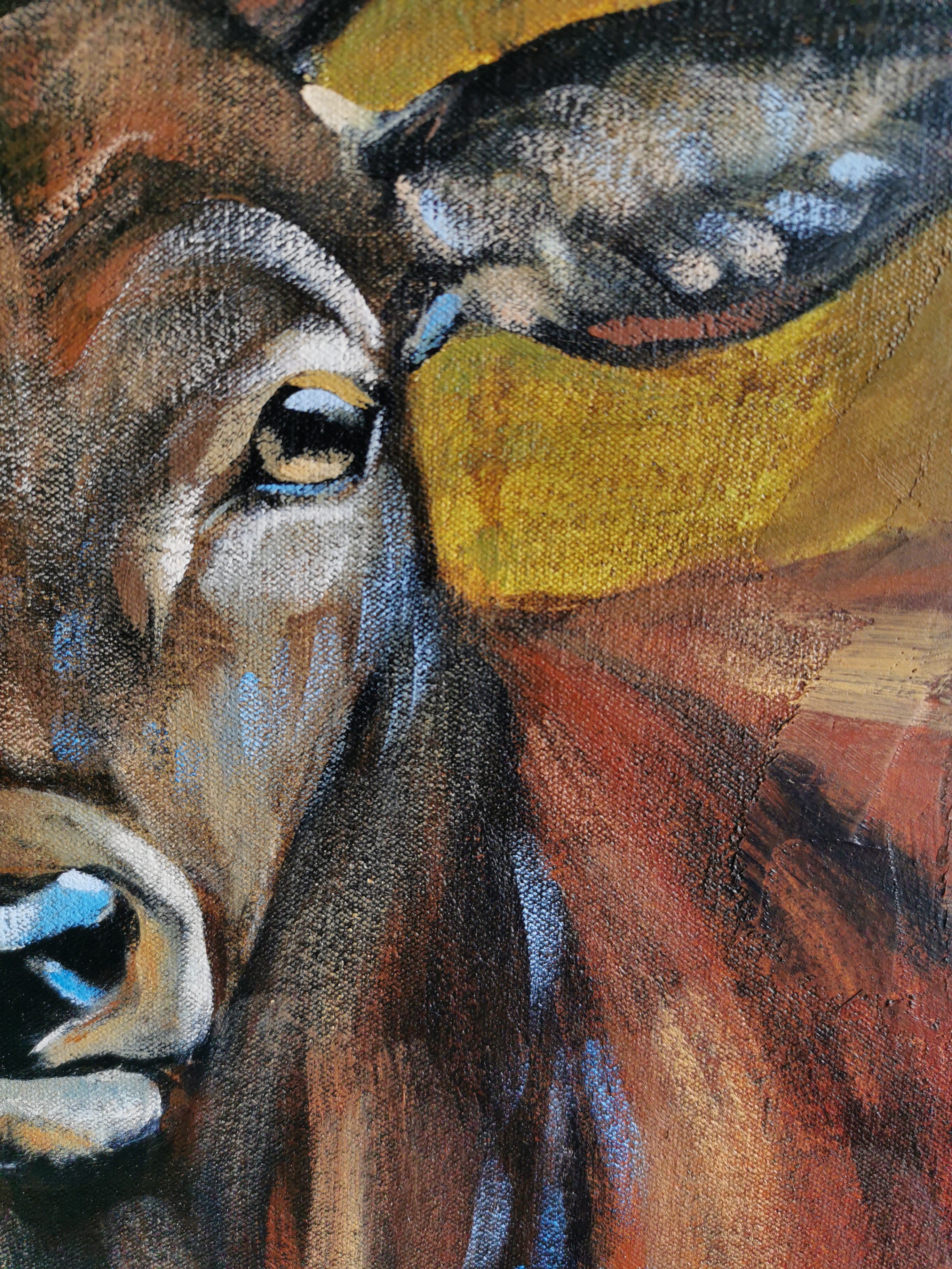 Close-up of a deer's face painted in brown and blue tones.