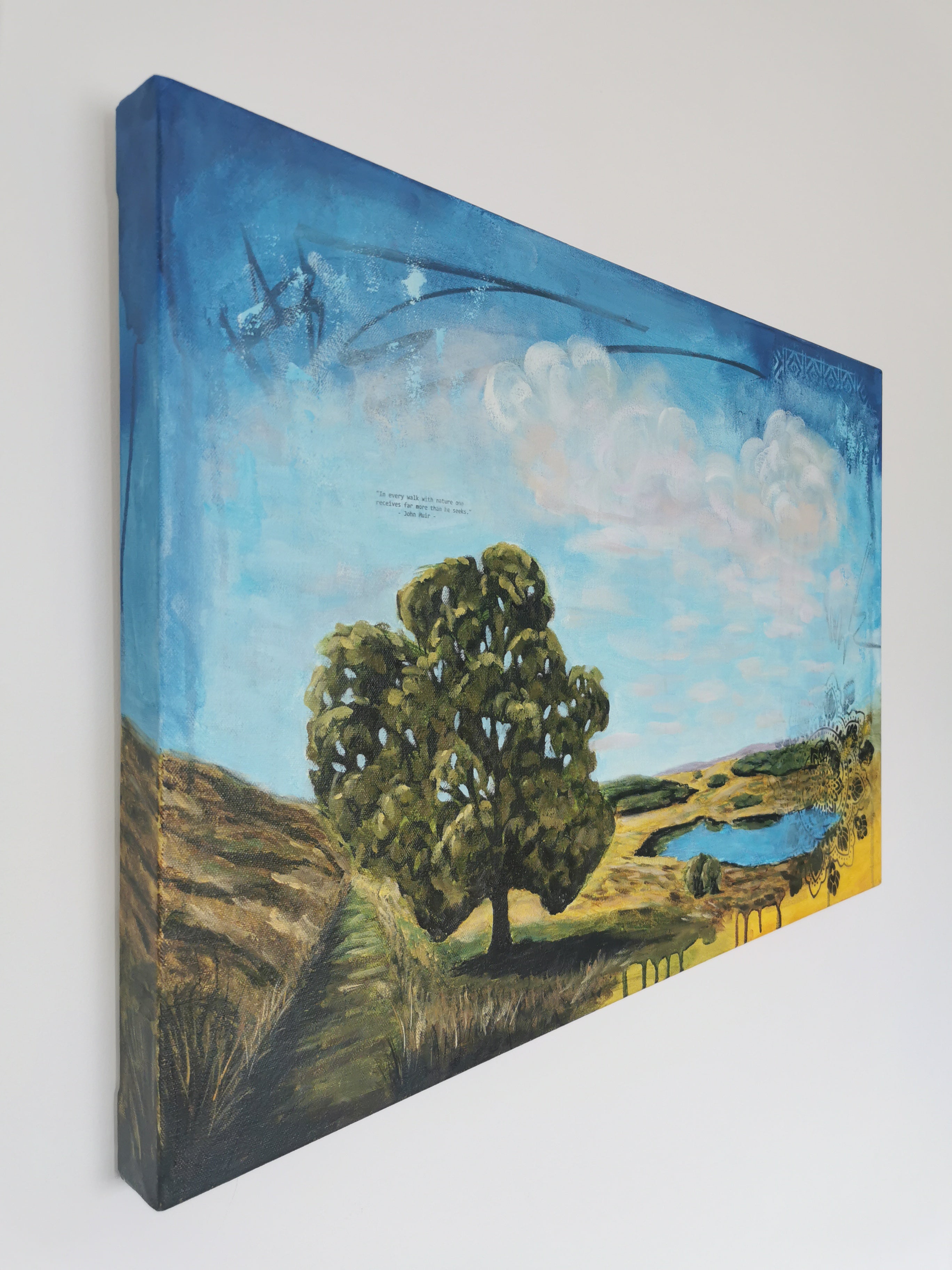 Painting of a tree and Calf Hey landscape on a wall.