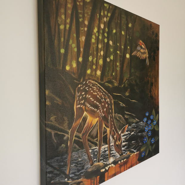 Stunning side view of a fawn in a forest scene with a bird