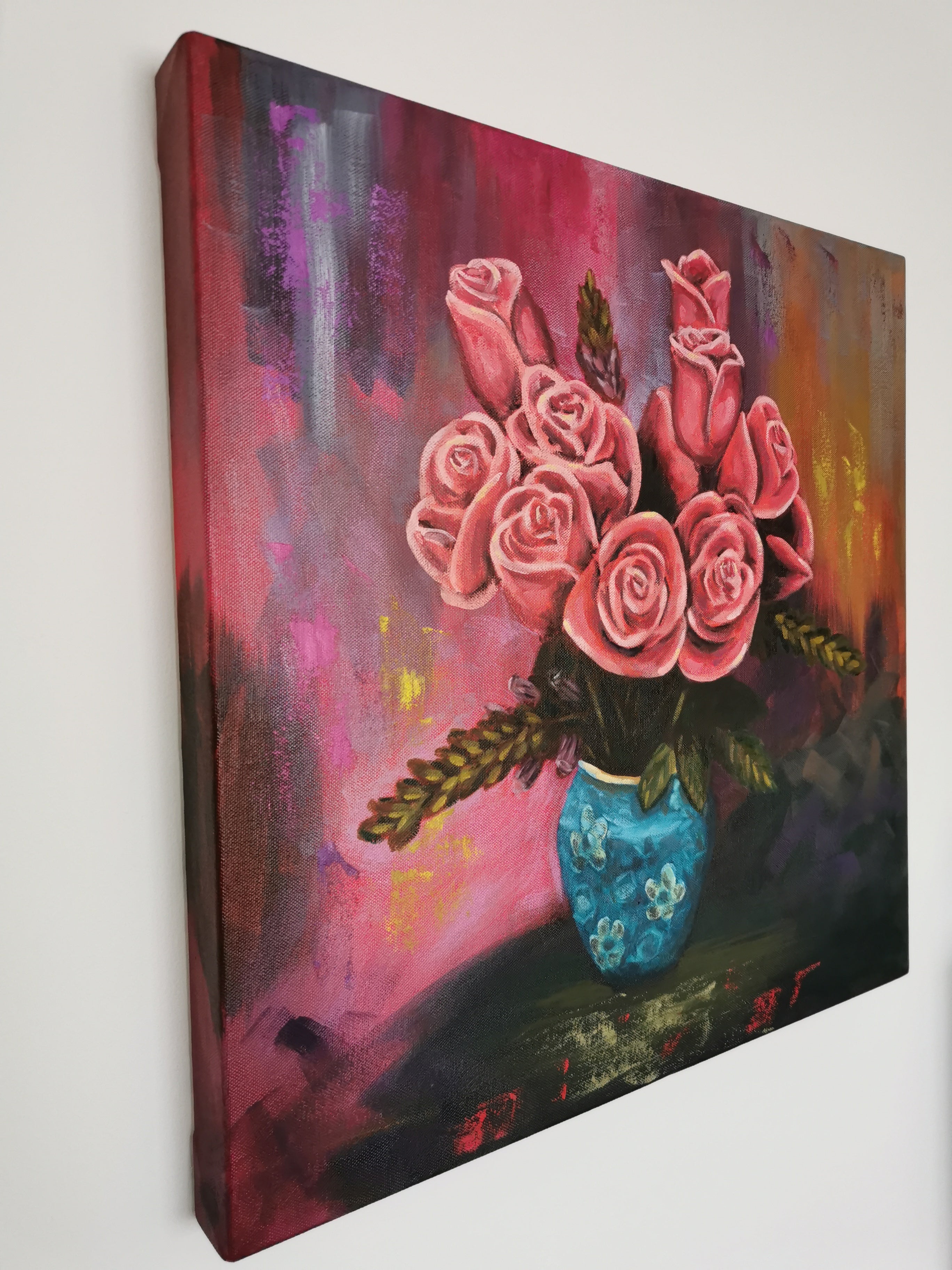 Canvas painting of pink roses in a blue vase 